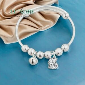VS bi bạc ta mix charm rồng và chuông Le'Mare Jewelry